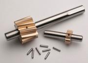 Gear/shaft assemblies and Coiled Spring Pins